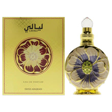 Perfume bottle with gold cap next to yellow Layali Eau de Parfum box