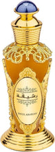 Ornate amber perfume oil bottle with blue domed cap and gold ridged base