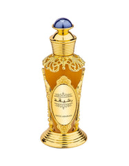 Swiss Arabian Rasheeqa perfume oil in an ornate gold bottle with a blue cap from Visit the Swiss Arabian Store