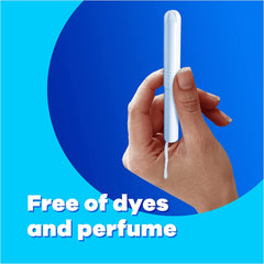 Tampax Compak Super Plus tampons white applicator held in hand on blue background with Free of dyes and perfume text
