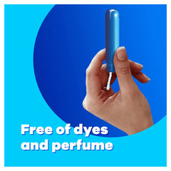 Hand holding blue applicator tampon against blue background with Free of dyes and perfume text Tampax Compak Super tampons UAE