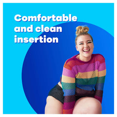 Tampax Compak Super tampons UAE promotional image with smiling woman in rainbow sweater on blue background