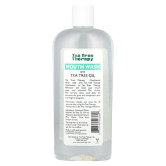 Tea Tree Therapy clear bottle mouthwash with white cap showing label tea tree oil mouthwash for fresh breath