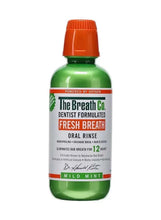 Oral rinse bottle with orange cap and green body, Fresh Breath mild mint label