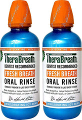 Two TheraBreath fresh breath oral rinse bottles in blue with orange caps dentist recommended invigorating icy mint