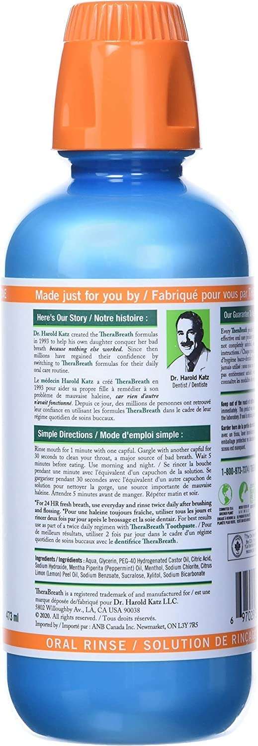 TheraBreath fresh breath oral rinse blue bottle with orange cap and back label showing directions and ingredients