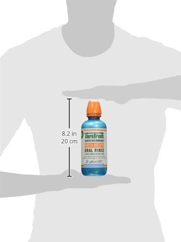 TheraBreath fresh breath oral rinse blue bottle with orange cap shown 8.2 in tall between hands silhouette