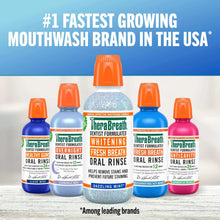 Assorted TheraBreath whitening oral rinse bottles with orange caps