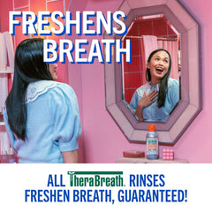 Woman smiling at mirror in pink bathroom with TheraBreath bottle on counter TheraBreath whitening mouthwash UAE