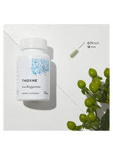 Iron bisglycinate supplement bottle with capsule size graphic and green capsules