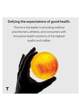 Hand holding a yellow glowing magnesium supplement capsule