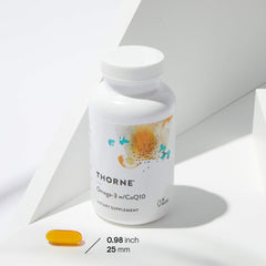 THORNE white bottle with abstract label and single yellow softgel on white background Omega-3 with CoQ10 supplement