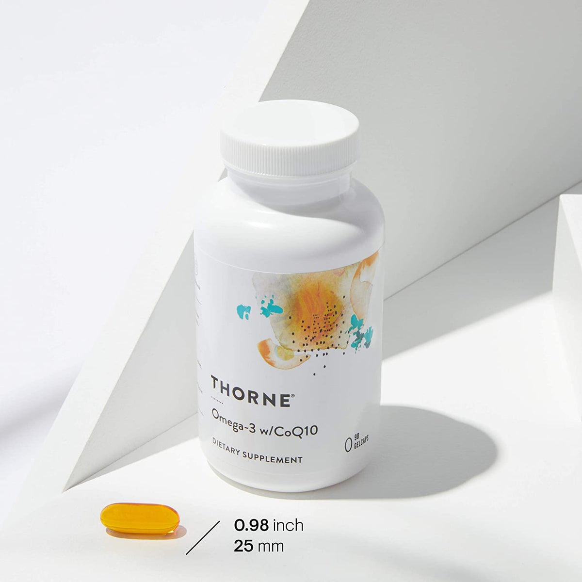 THORNE white bottle and yellow softgel on white background Omega-3 with CoQ10 supplement