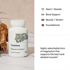 THORNE magnesium citrate malate supplement white bottle on marble table showing label art and text about heart bone muscle support