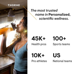 Thorne Vitamin D liquid supplement UAE in a woman's hand for enhanced wellness and health support