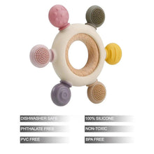 Pink, yellow, and purple silicone teething ring toy with wooden center and textured pads