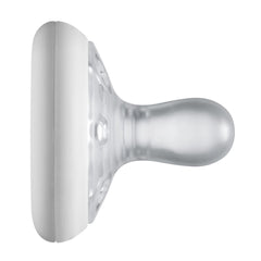 Clear silicone Tommee Tippee breast-like pacifier with white shield shown in side profile for newborn soothing
