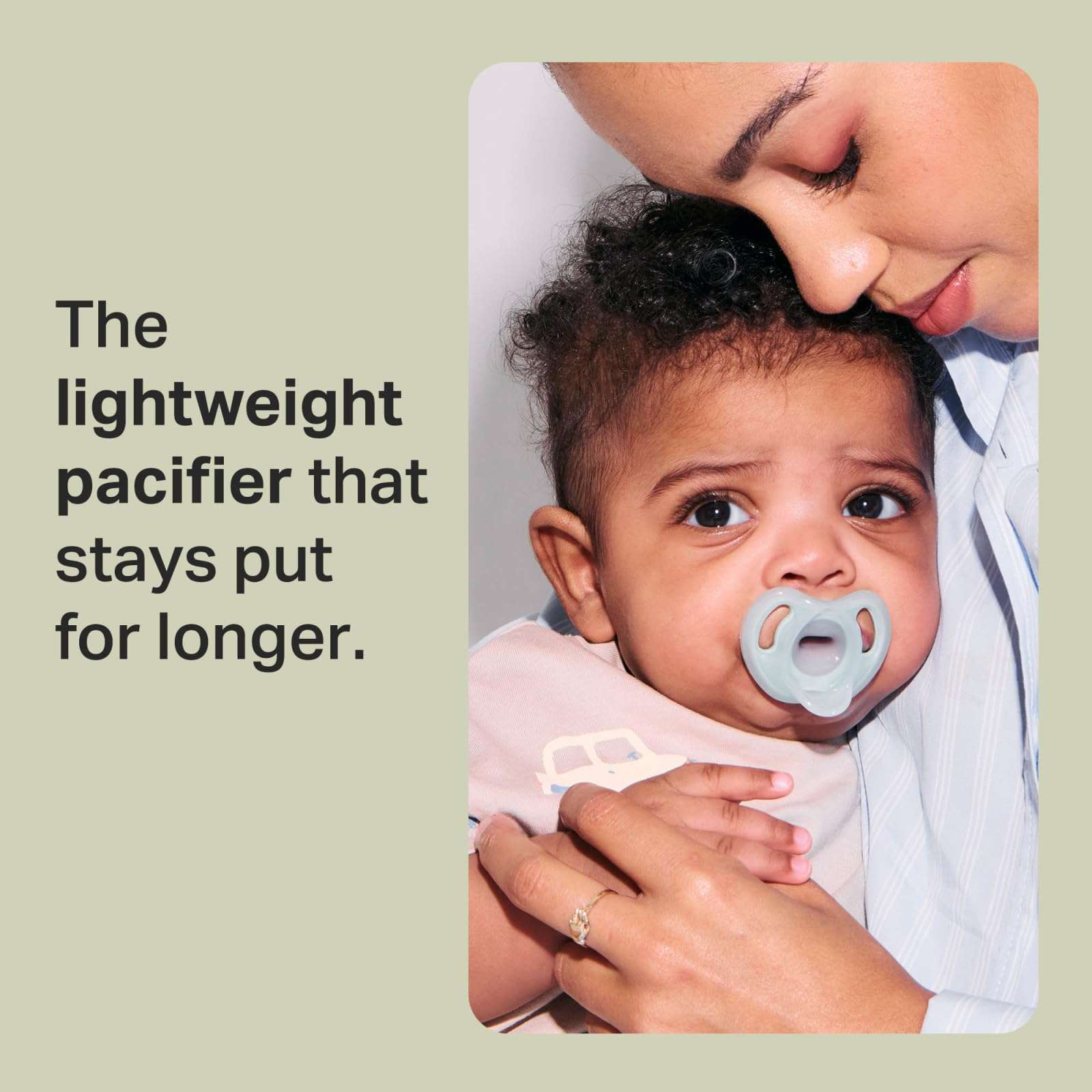Mother holding baby using Tommee Tippee silicone soother 0-6 months in light blue pacifier