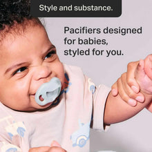 Baby wearing a light blue orthodontic silicone soother