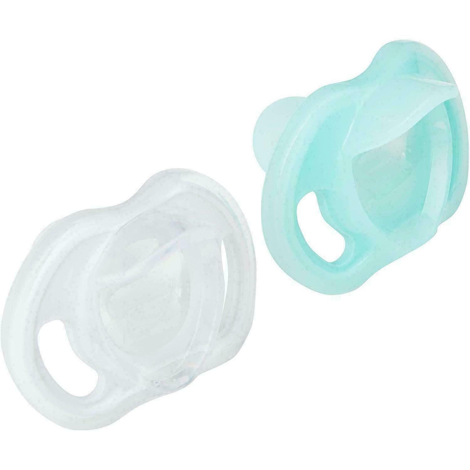 Two Tommee Tippee ultra light soother pacifiers in clear and mint green silicone with ergonomic shield holes