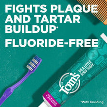 Fluoride-free toothpaste with purple toothbrush, 'Fights plaque and tartar buildup' text.