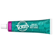 Fluoride-free toothpaste tube, mint green and purple with Tom's of Maine logo.