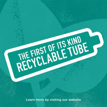 Recyclable tube label on green toothpaste packaging with white border text.