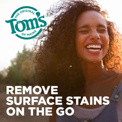 Smiling woman outdoors with Toms of Maine logo and text promoting fluoride free natural toothpaste for stain removal