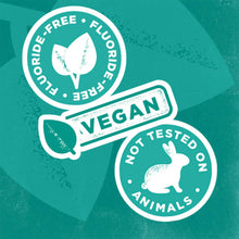 Vegan, fluoride-free, and not tested on animals badges on green toothpaste packaging.