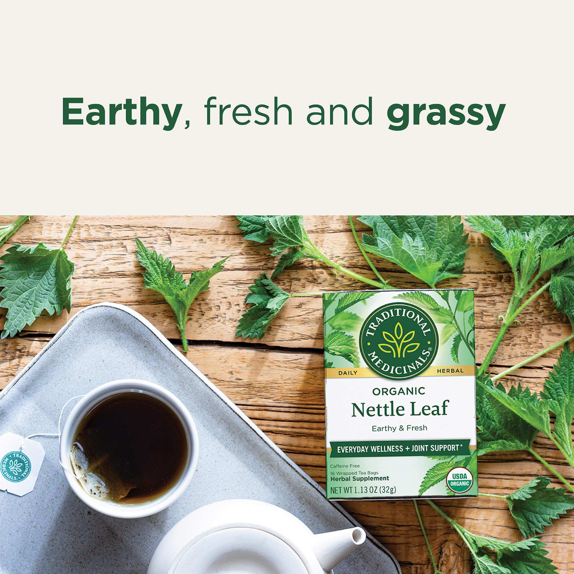 Traditional Medicinals nettle tea UAE Organic Nettle Leaf box with cup and fresh nettle leaves on wood