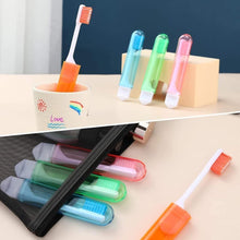 Colorful folding travel toothbrushes with caps in a black zipper travel pouch
