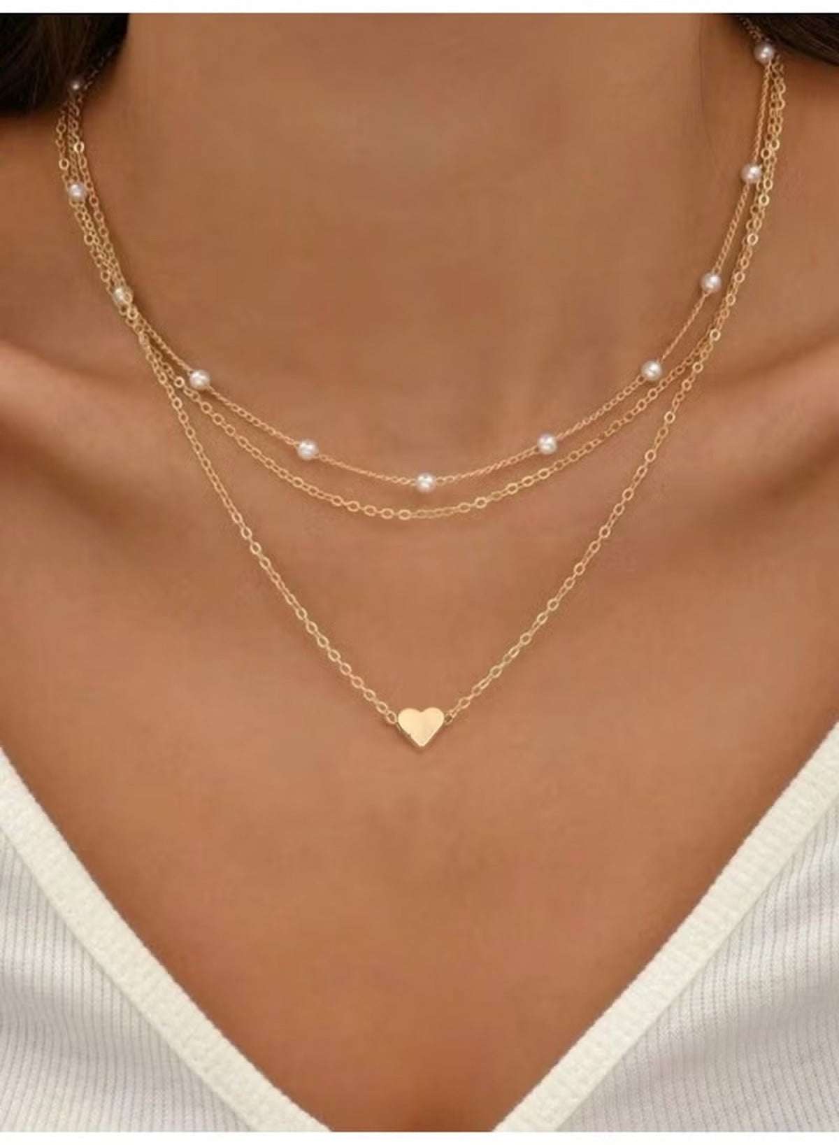 Mumzar triple layer pearl choker necklace featuring delicate gold chains and heart pendant