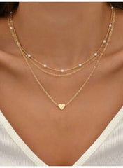 Mumzar triple layer pearl choker necklace featuring delicate gold chains and heart pendant