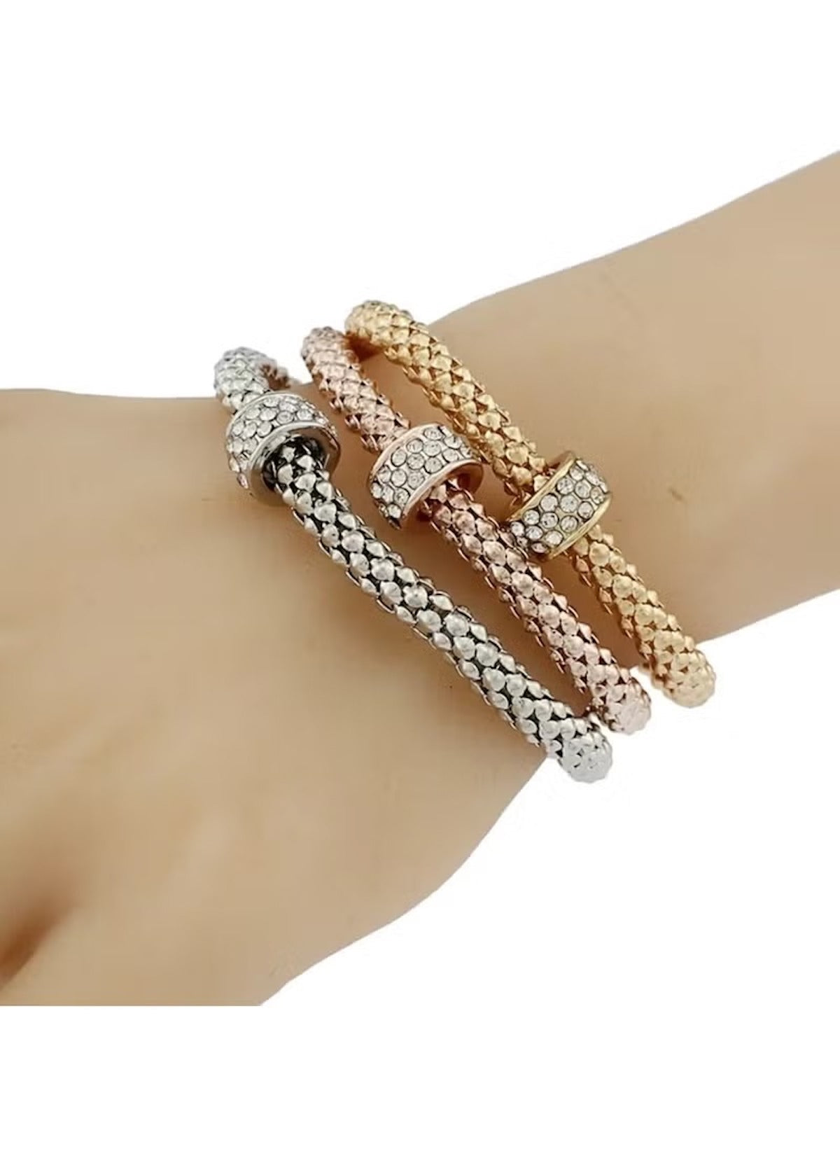 Huitich triple tone crystal bracelets set in silver, rose gold, and gold on wrist