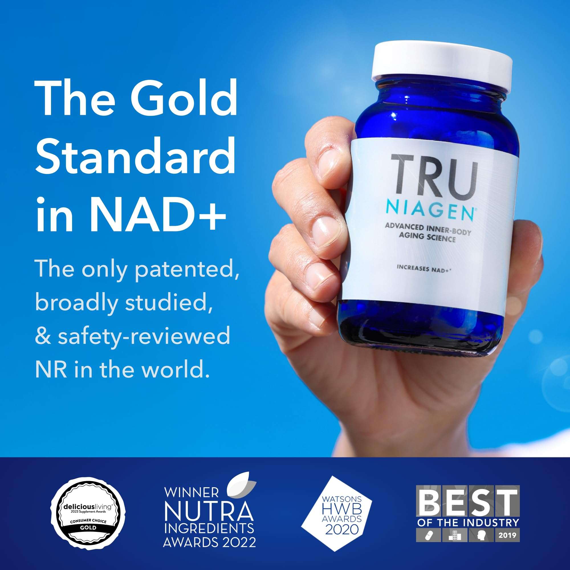 TRU NIAGEN blue glass bottle with white cap held in hand on blue background nicotinamide riboside supplement