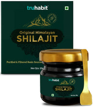 Shilajit resin jar with gold lid and green label, with product box behind