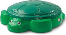Green turtle sandbox with turtle head and hinged shell lid