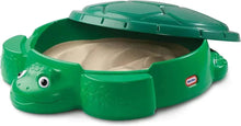 Green turtle sandbox with open lid, molded head and shell detail