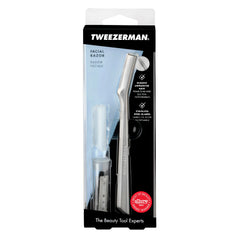 Tweezerman facial razor for women in clear retail packaging showing stainless steel razor with protective cap