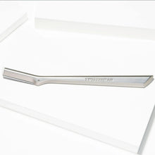 Long silver facial razor dermaplaner with straight blade edge