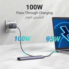 UGREEN USB C hub with HDMI for MacBook Pro featuring 100W pass-through charging connected to laptop and power outlet