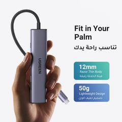 UGREEN USB C hub with HDMI for MacBook Pro with slim 12mm body and lightweight design held in hand