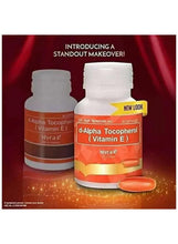 Vitamin E softgel bottles with orange labels and loose softgels