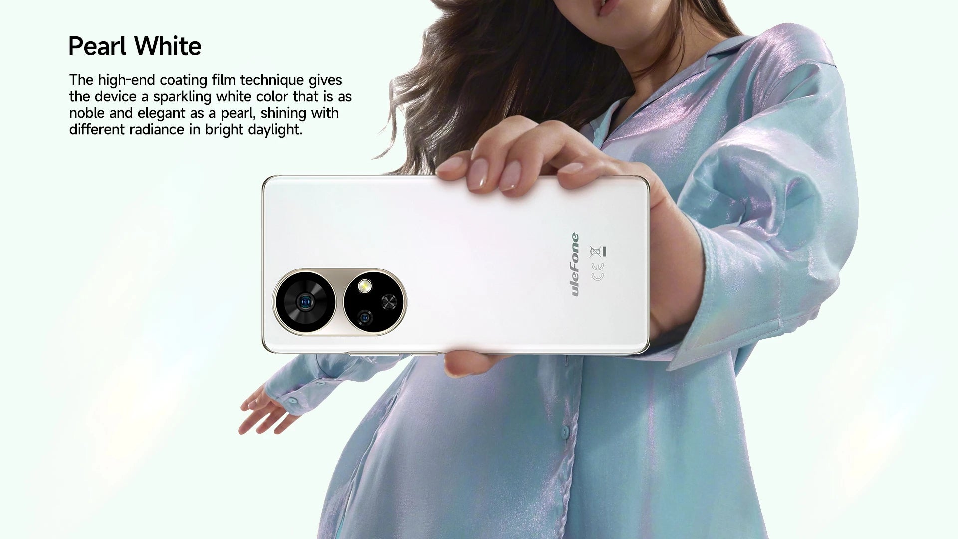 Woman holding pearl white Ulefone Note 17 Pro smartphone showing dual circular rear cameras