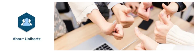 Unihertz team giving thumbs up over laptop with company logo banner promoting mini smartphone android 13