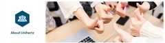 Unihertz team giving thumbs up over laptop with company logo banner promoting mini smartphone android 13