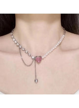 Pearl necklace with pink heart crystal center and long chain drop charm