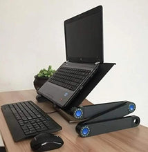 Portable laptop desk on a table with black platform, mouse, keyboard, and adjustable legs