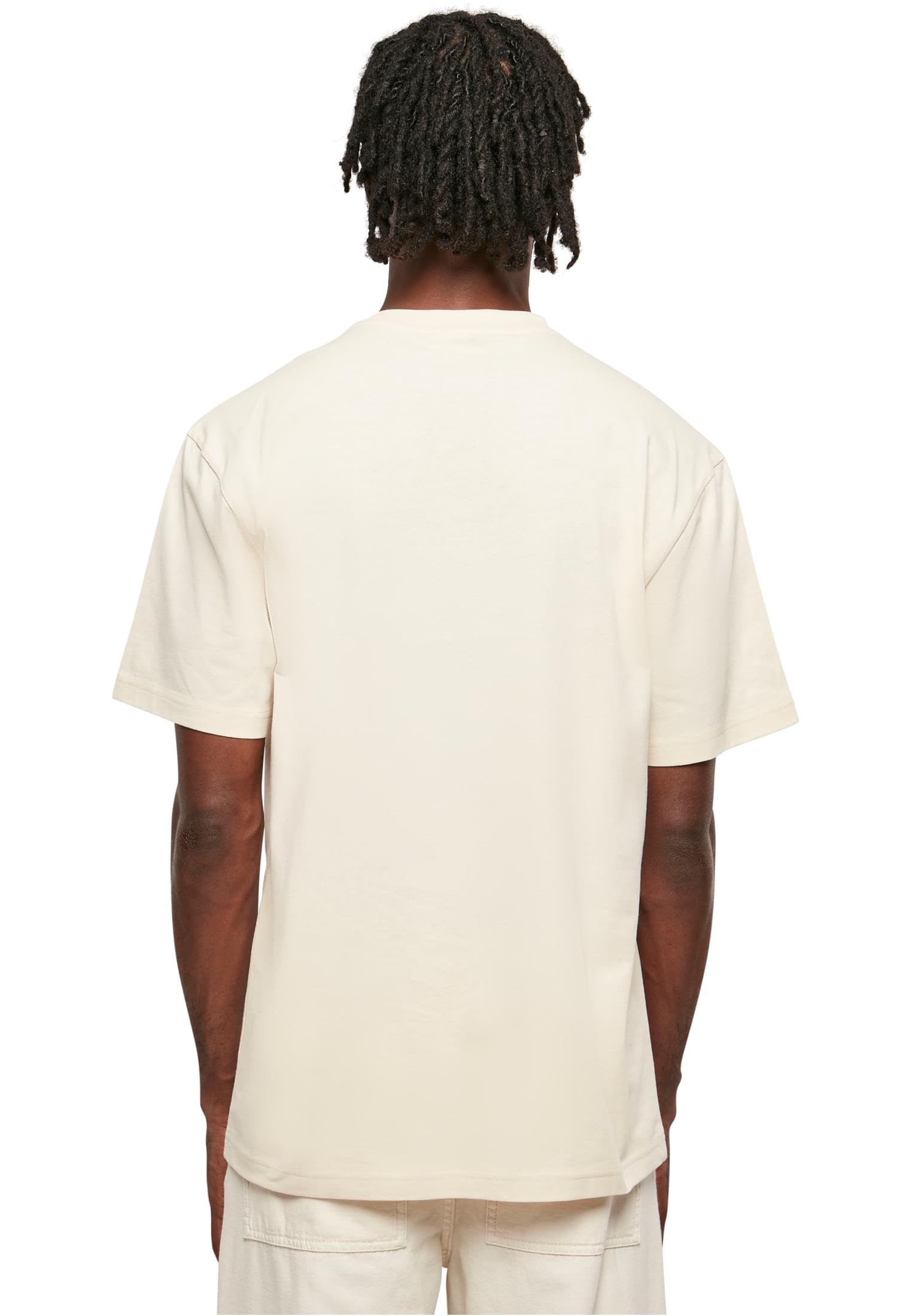 Back view of a man wearing an off-white urban classics tall tee for men with short sleeves