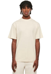 Urban Classics tall tee for men in beige worn by male model with short dreadlocks